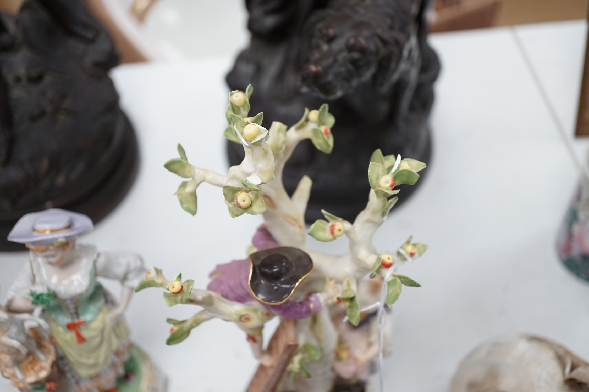 A Meissen apple pickers figure group and a pair of Dresden porcelain groups, tallest 29cm. Condition - some damage